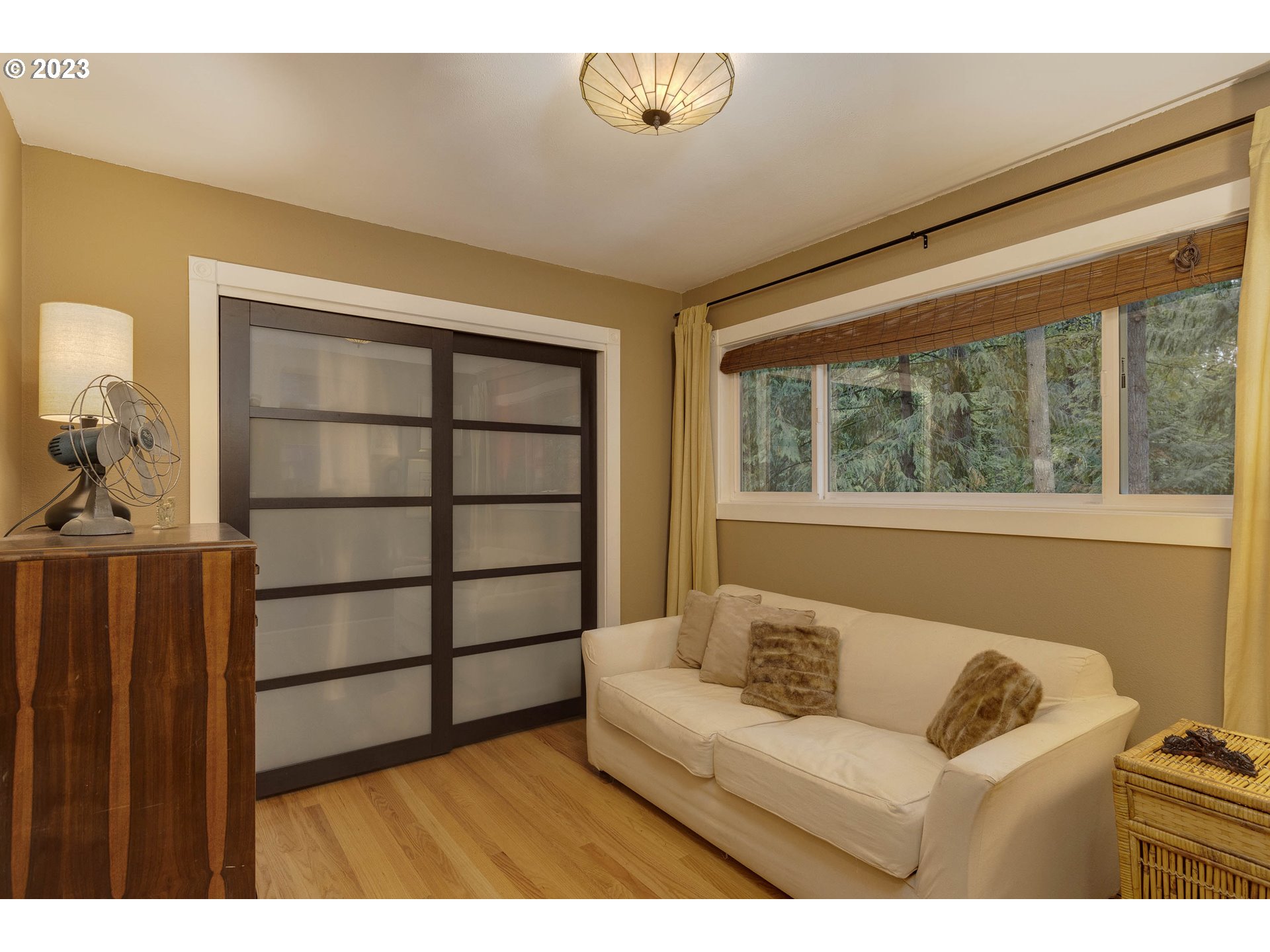 9732 Southwest 18th Place Portland, OR 97219 - Photo 26 of 45 a living room with furniture and a window