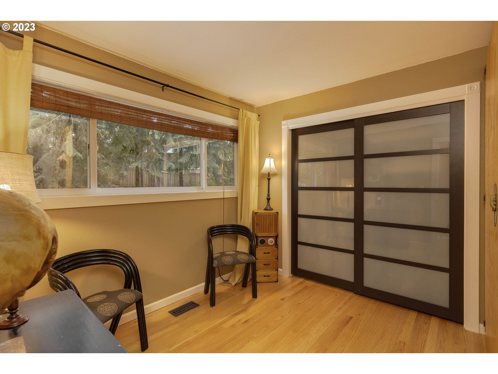 9732 Southwest 18th Place Portland, OR 97219 - Photo 27 of 45 a black and white photo of a chair and table