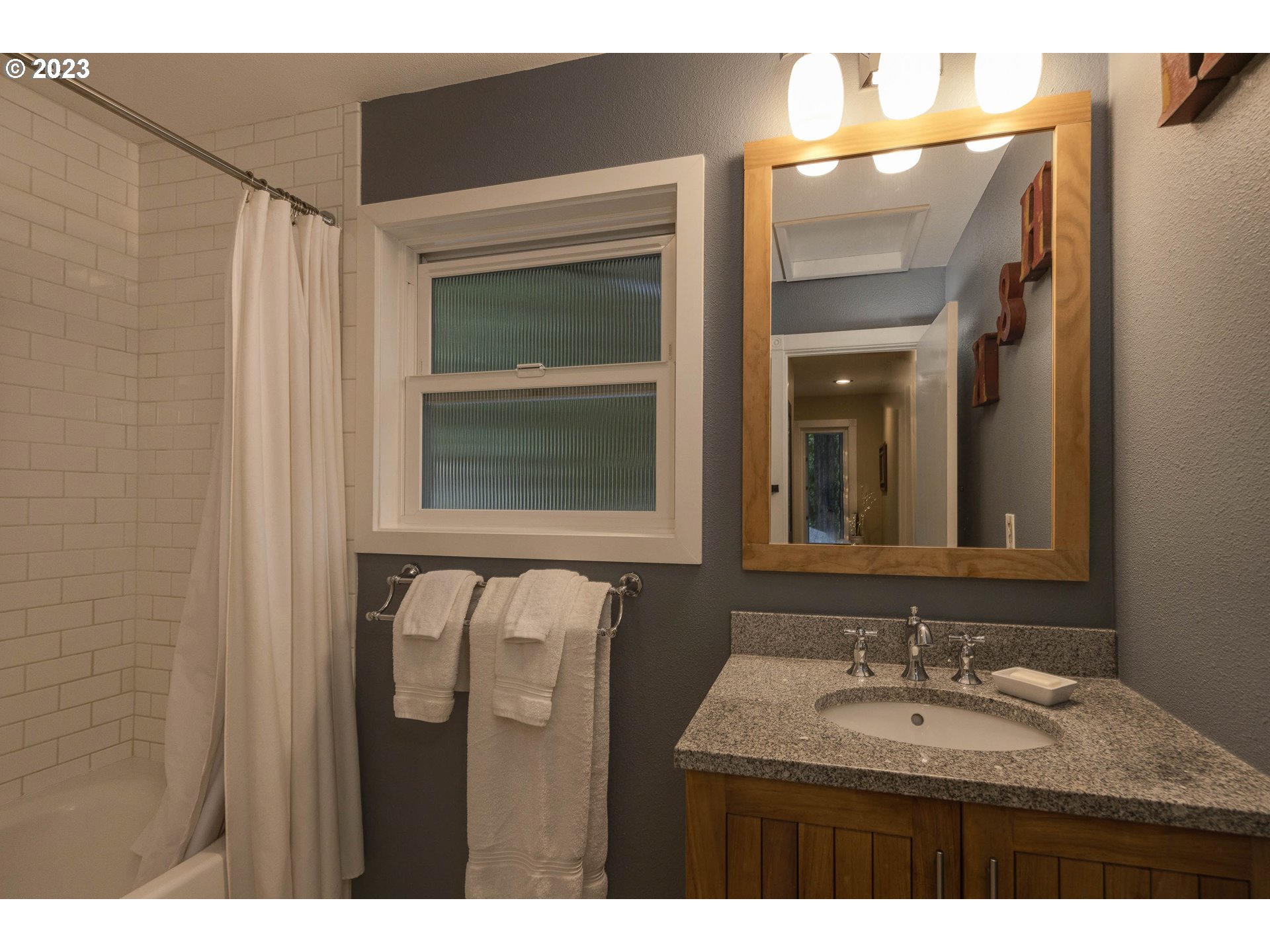 9732 Southwest 18th Place Portland, OR 97219 - Photo 29 of 45 a bathroom with a sink and a mirror