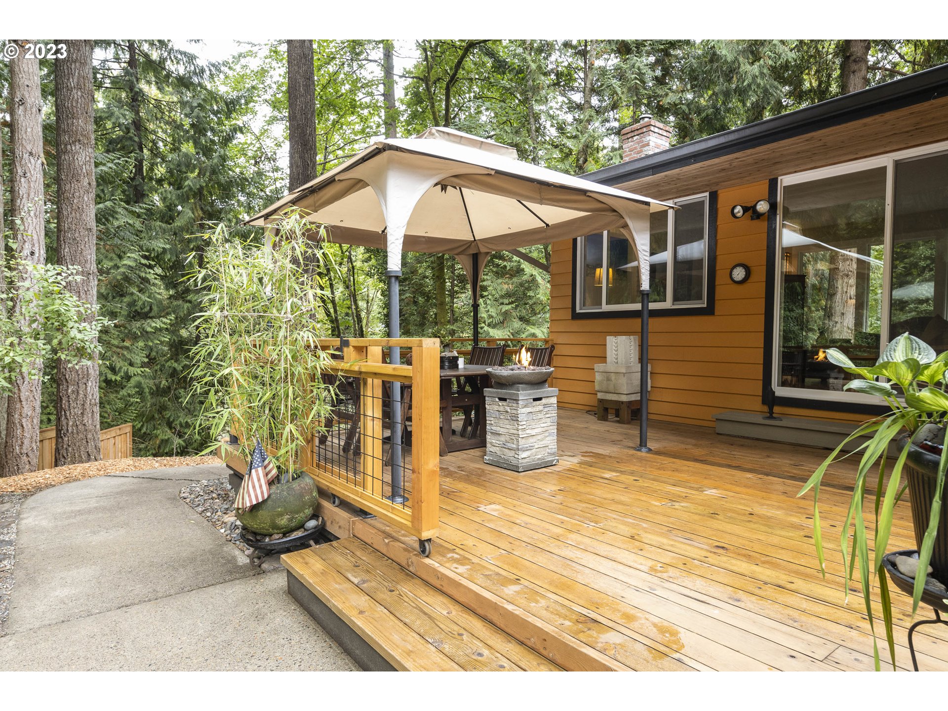 9732 Southwest 18th Place Portland, OR 97219 - Photo 31 of 45 a view of a chair and tables in the patio