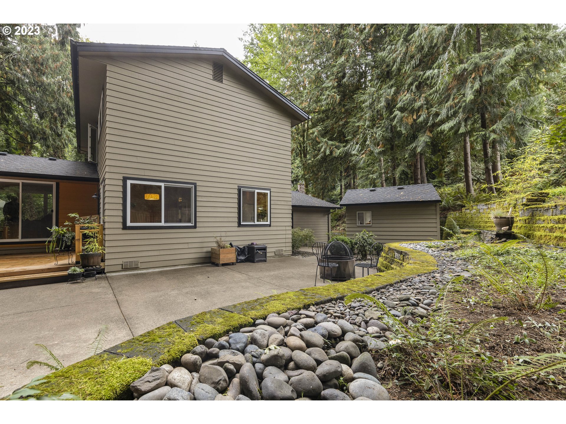 9732 Southwest 18th Place Portland, OR 97219 - Photo 37 of 45 a backyard of a house with yard and seating space