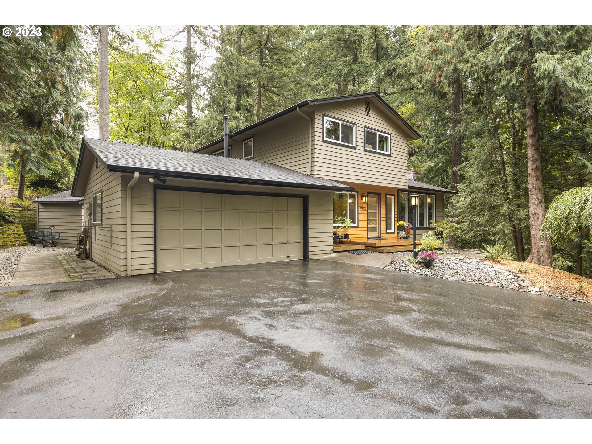 9732 Southwest 18th Place Portland, OR 97219 - Photo 4 of 45 a front view of a house with a yard