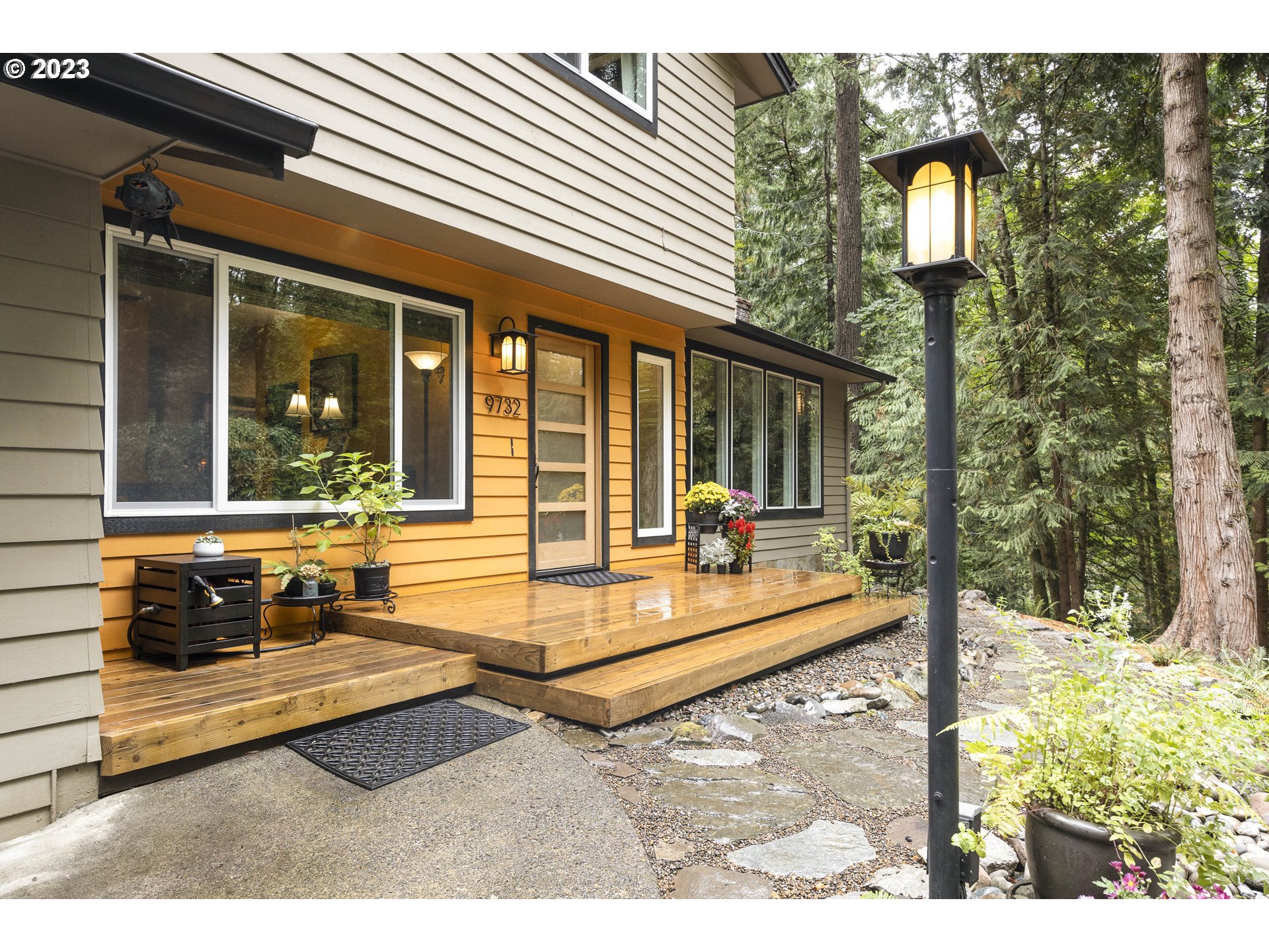 9732 Southwest 18th Place Portland, OR 97219 - Photo 5 of 45 a view of a house with backyard and porch