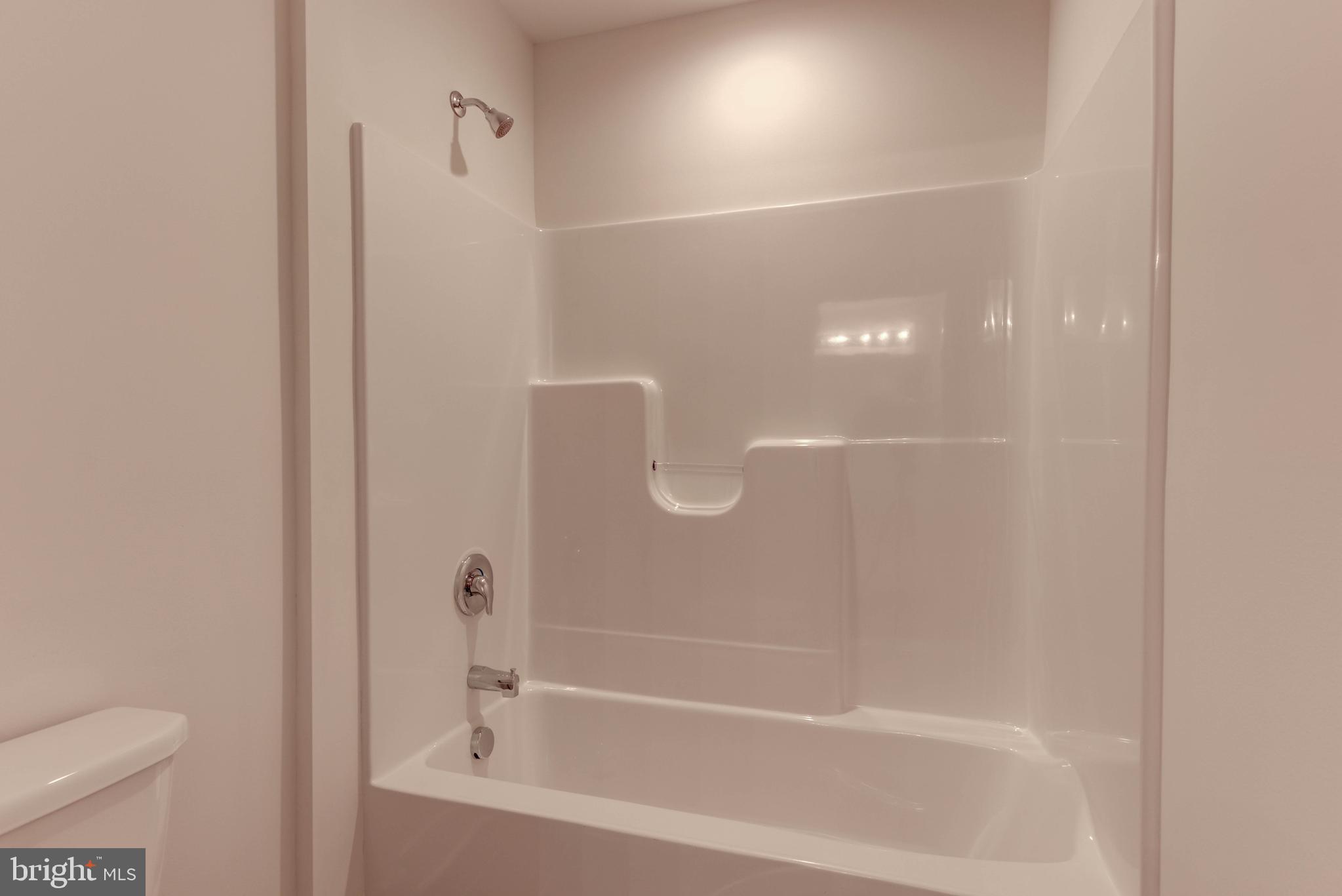 11010910 Risinghurst Lane Oxford, PA 19363 - Photo 32 of 34 a white bath tub sitting next to a toilet