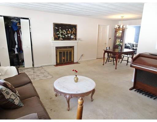 26 Raleigh Road Framingham, MA 01701 - Photo 5 of 21 a living room with furniture a fireplace and a flat screen tv