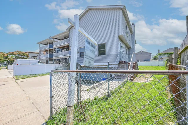 a view of swimming pool with outdoor seating and deck