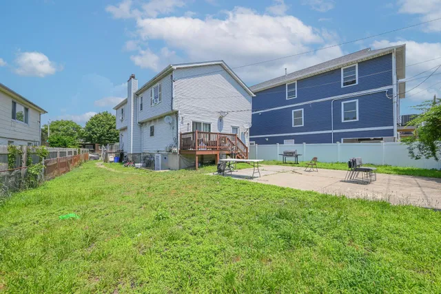 a view of a house with a back yard