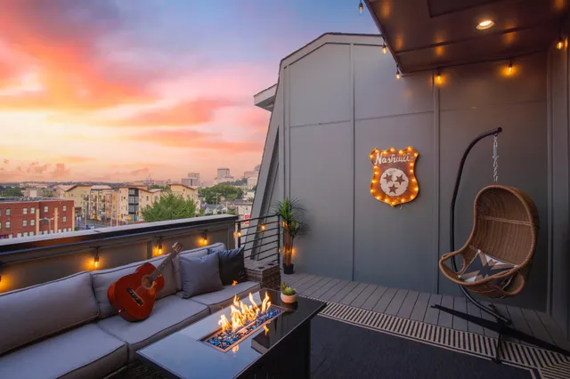 an outdoor living room with furniture