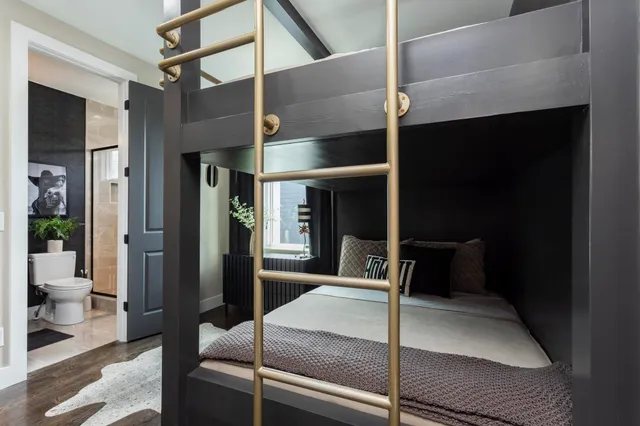 a bathroom with a sink a toilet a mirror and shower