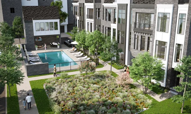 an aerial view of residential houses with outdoor space