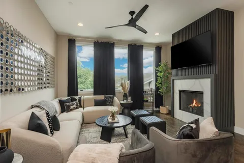 a living room with furniture fireplace and a flat screen tv