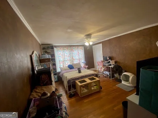 a bedroom with bed and a window