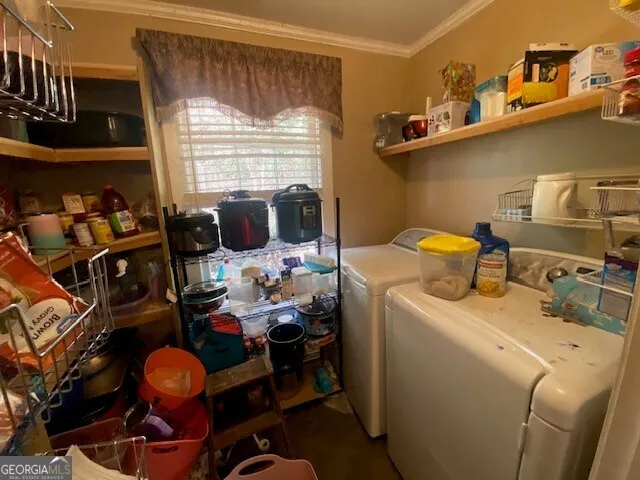 a storage room with washer and dryer
