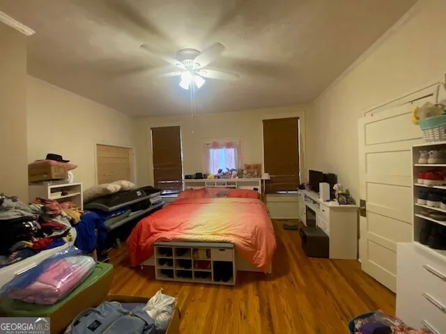 a bed room with a bed and a chandelier