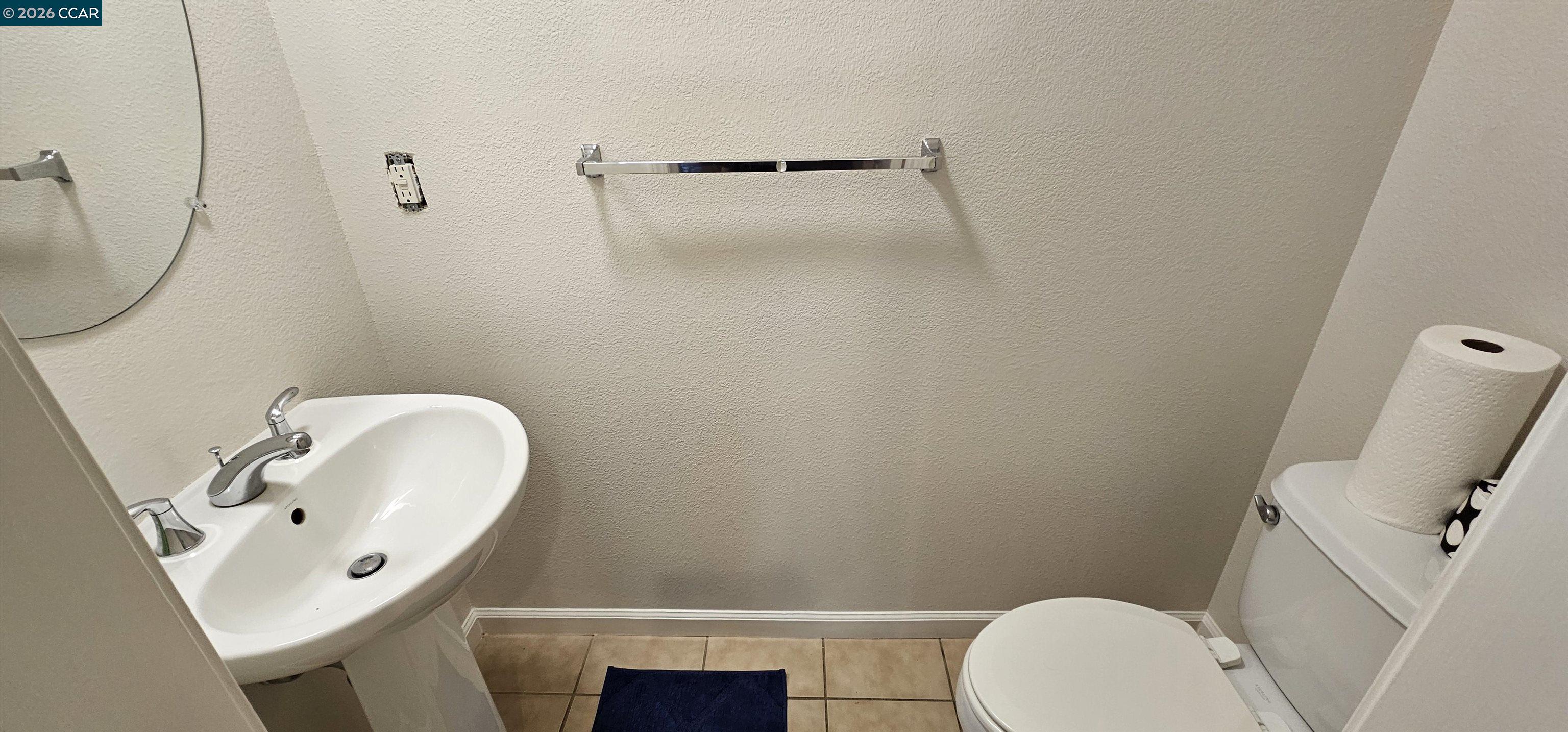 2297 Orleans Street Santa Rosa, CA 95403 - Photo 11 of 30 a bathroom with a toilet sink and mirror