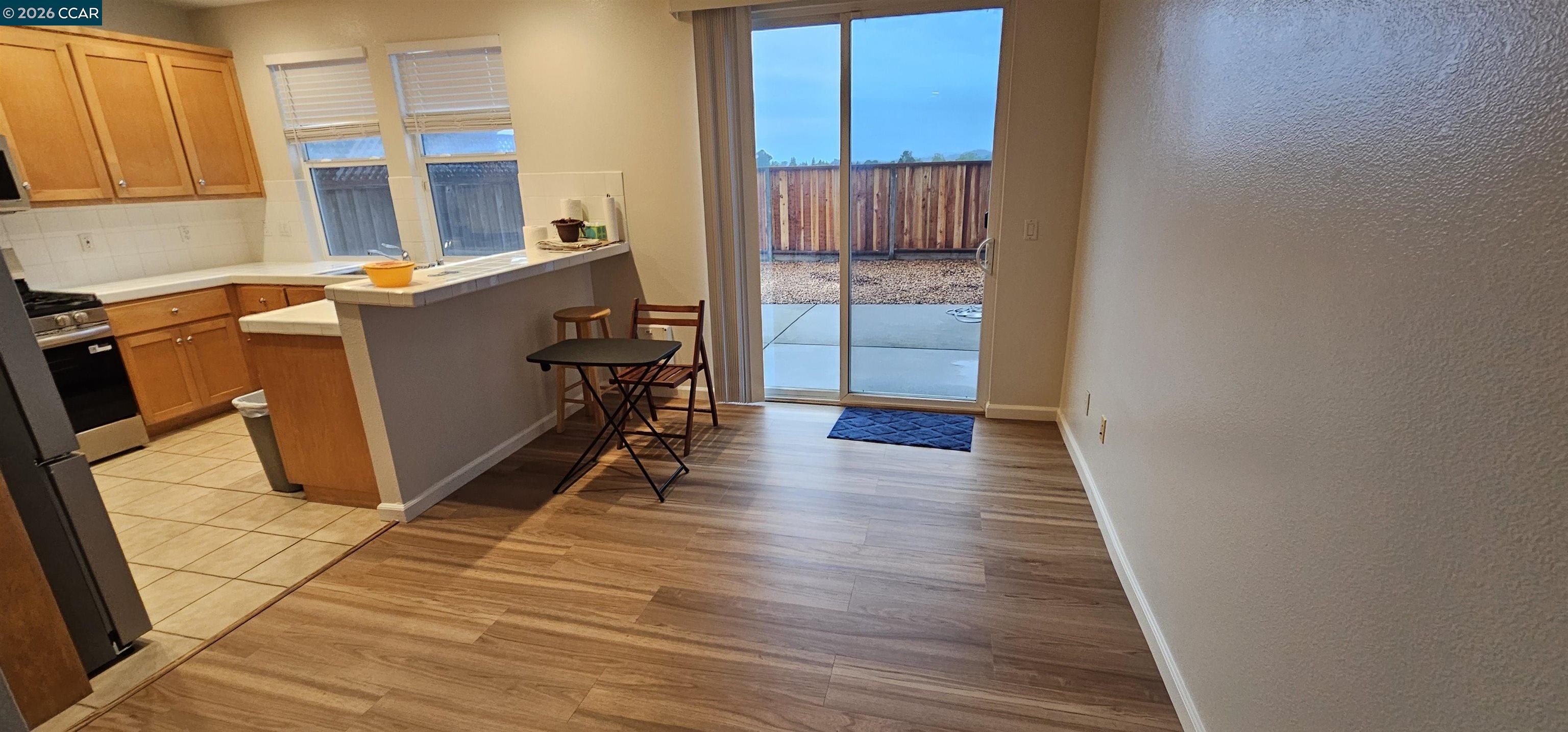 2297 Orleans Street Santa Rosa, CA 95403 - Photo 6 of 30 a view of a hallway with wooden floor and staircase