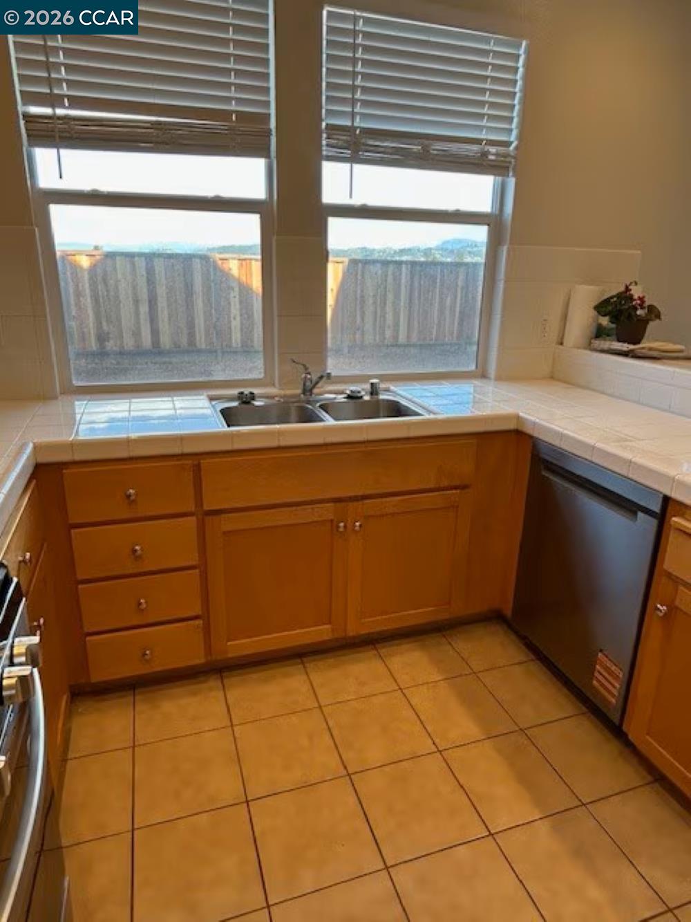 2297 Orleans Street Santa Rosa, CA 95403 - Photo 10 of 30 a kitchen with a sink a counter top space and appliances