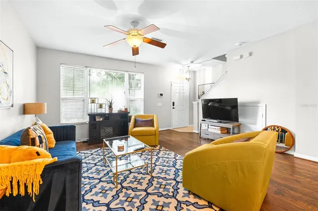 a bedroom with furniture and a flat screen tv