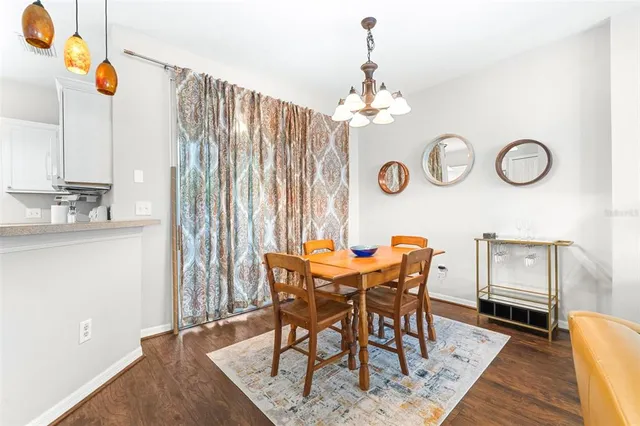 a kitchen with a sink window and cabinets