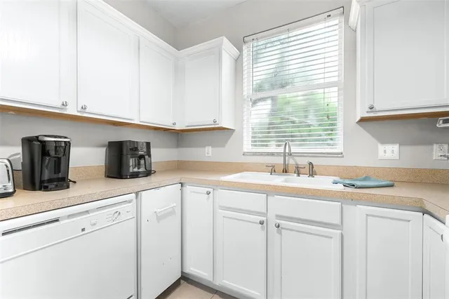a bathroom with a sink a toilet a mirror and vanity