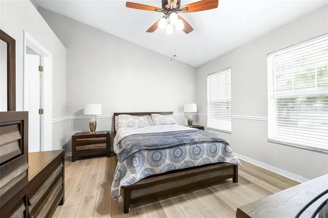 a bathroom with a sink a toilet and shower curtain