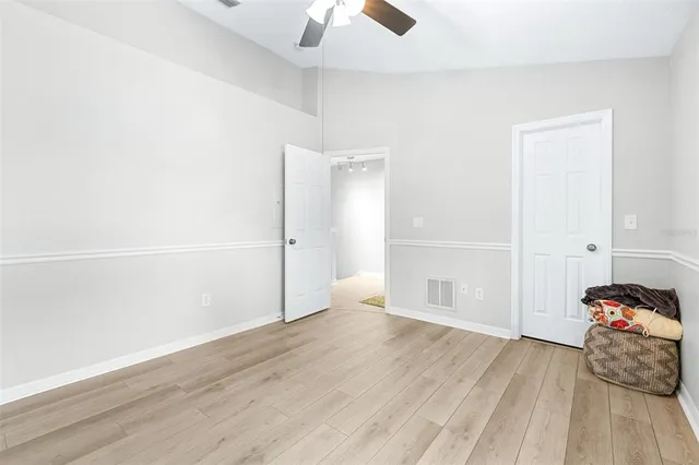 a backyard of a house with plants and outdoor seating