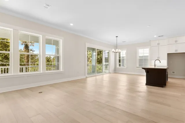 a kitchen with white cabinets and a stove