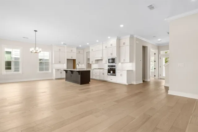 a view of storage and utility room with closet