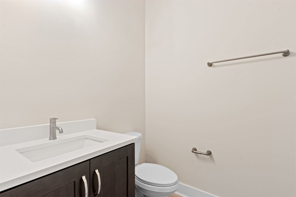 96606 Compass Point Drive Fernandina Beach, FL 32034 - Photo 23 of 88 a bathroom with a sink a toilet and mirror