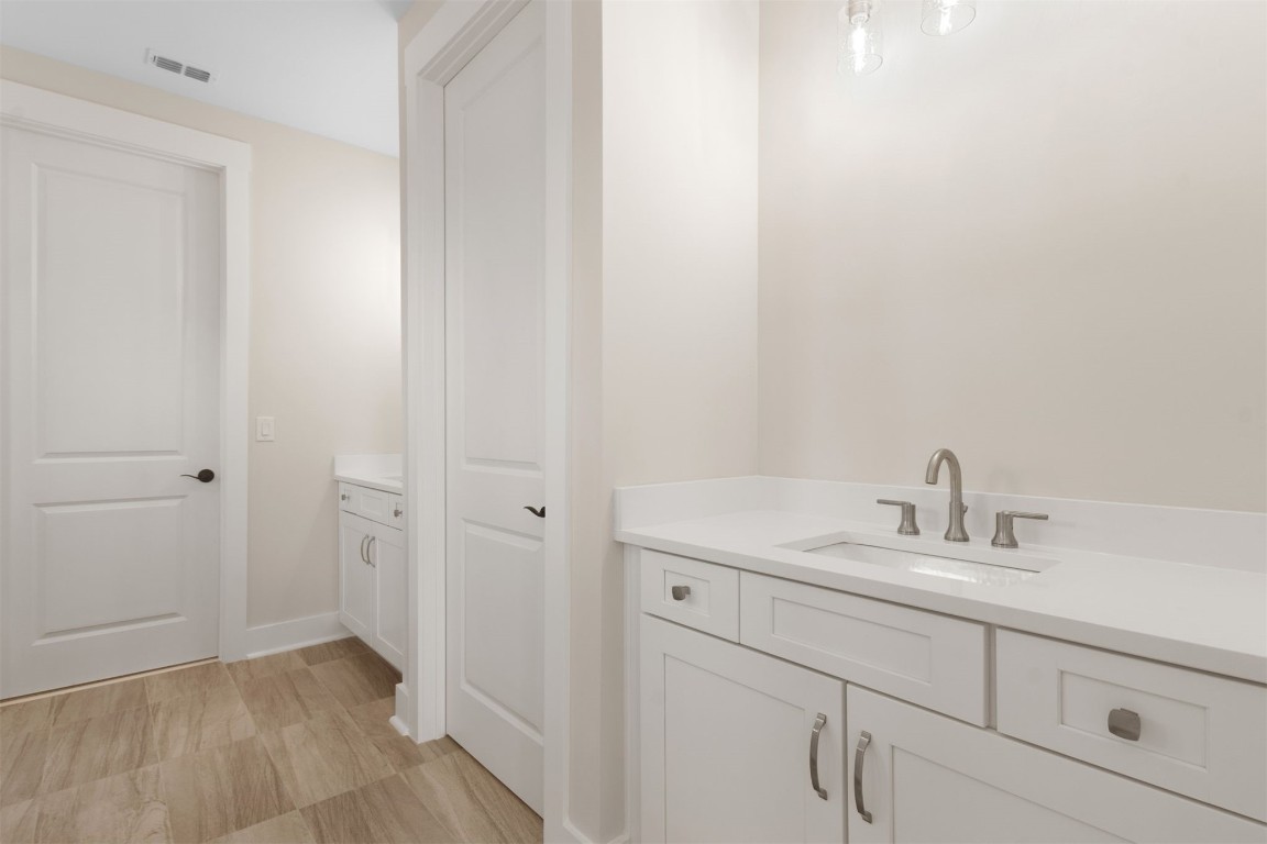 96606 Compass Point Drive Fernandina Beach, FL 32034 - Photo 29 of 88 a bathroom with a sink and a mirror