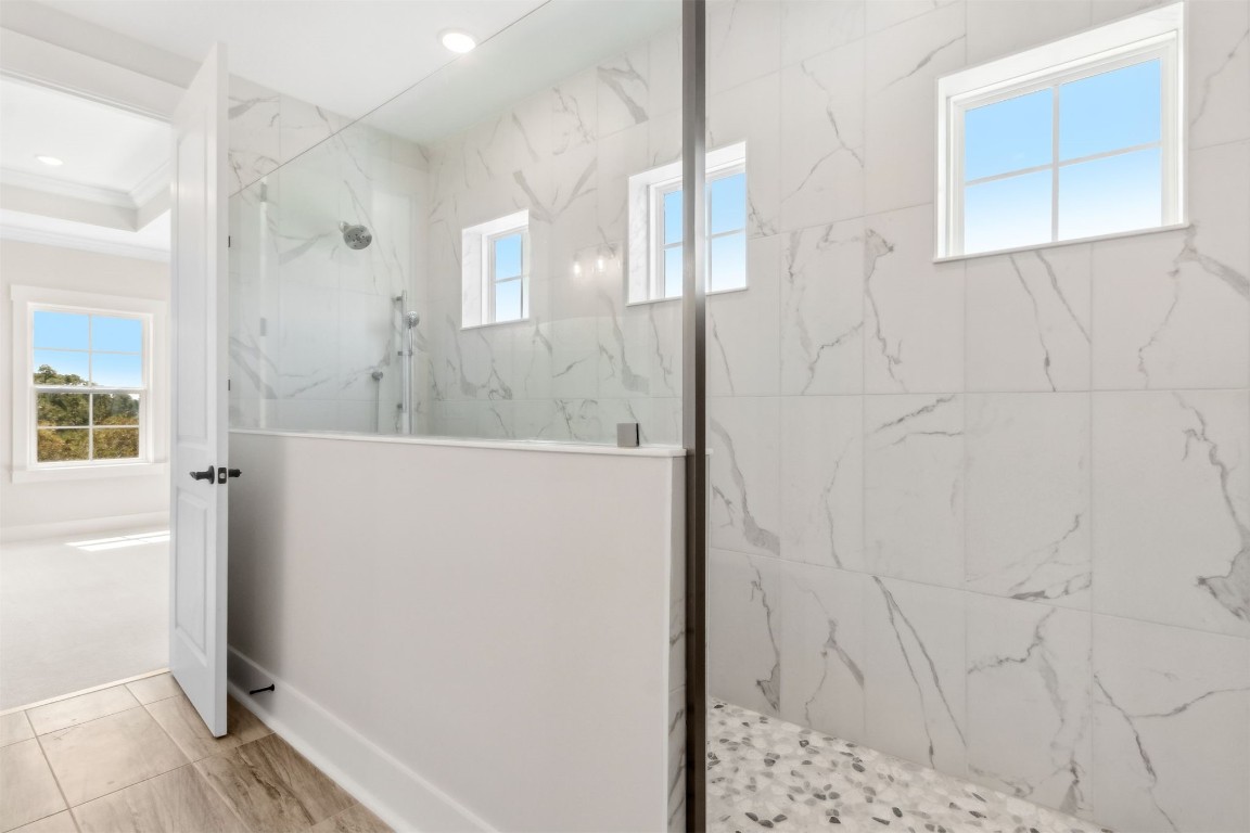 96606 Compass Point Drive Fernandina Beach, FL 32034 - Photo 30 of 88 a bathroom with a bathtub and a shower