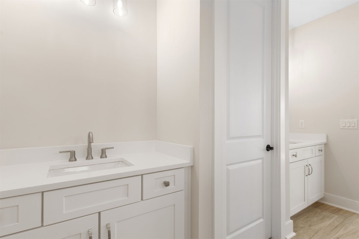 96606 Compass Point Drive Fernandina Beach, FL 32034 - Photo 31 of 88 a bathroom with a sink and a mirror