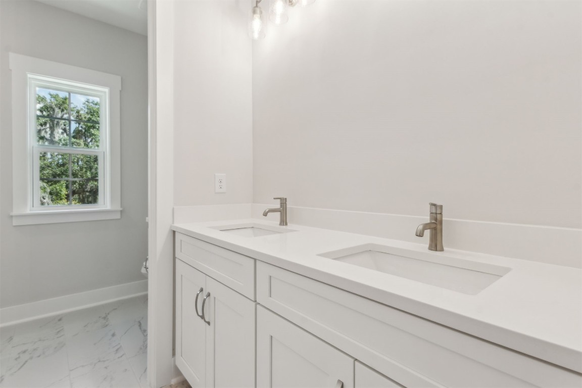 96606 Compass Point Drive Fernandina Beach, FL 32034 - Photo 35 of 88 a bathroom with a sink and a window