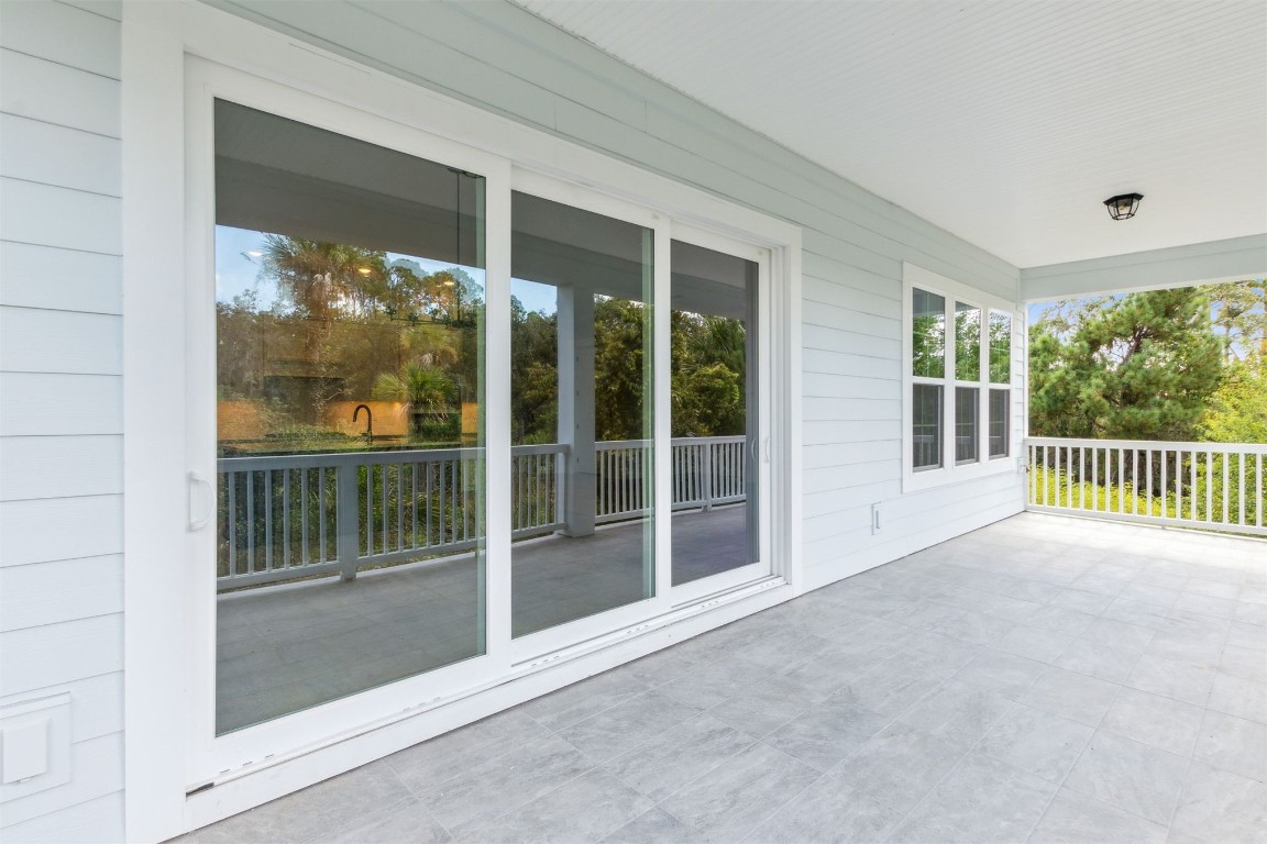 96606 Compass Point Drive Fernandina Beach, FL 32034 - Photo 8 of 88 a view of a room with balcony and floor to ceiling window