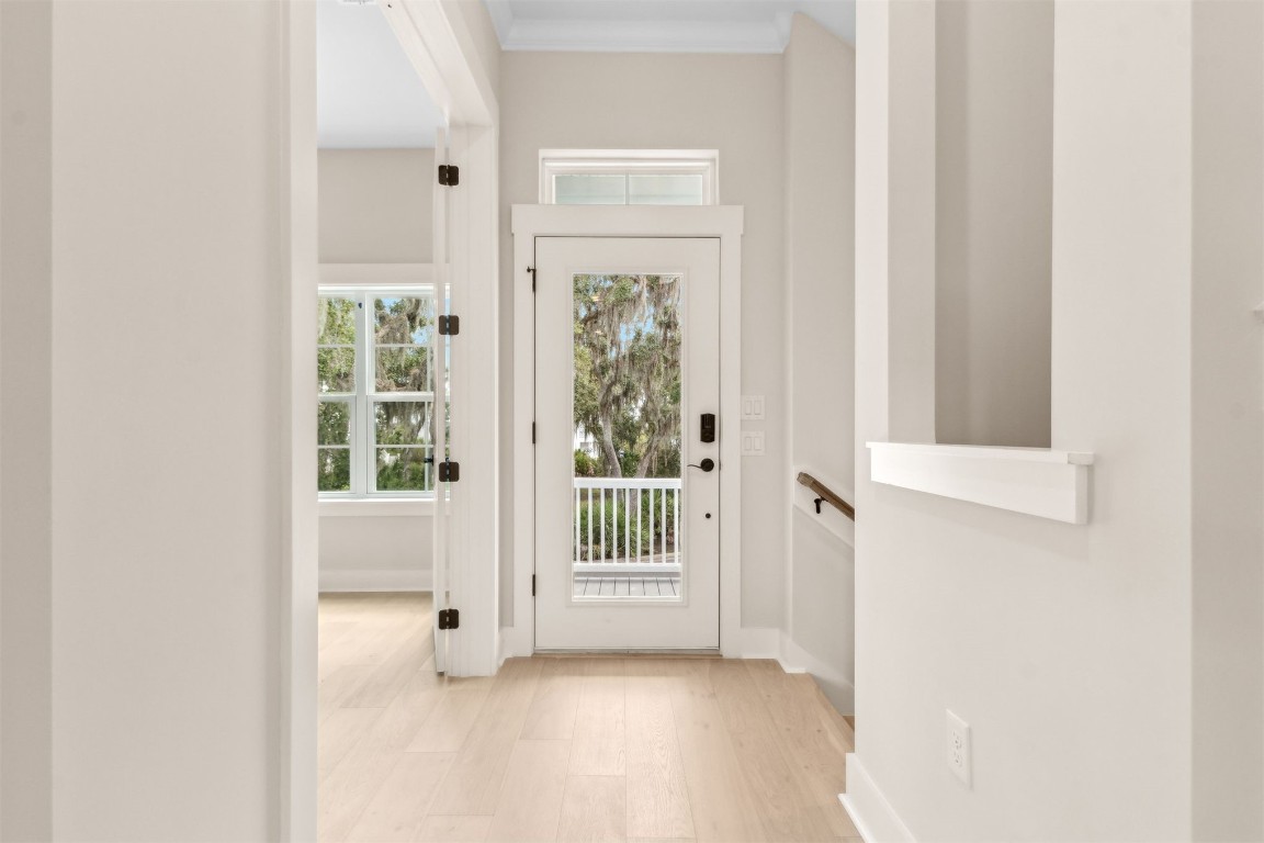 96606 Compass Point Drive Fernandina Beach, FL 32034 - Photo 9 of 88 a view of a hallway with windows and entryway