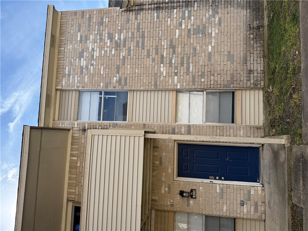 a front view of a house with stairs