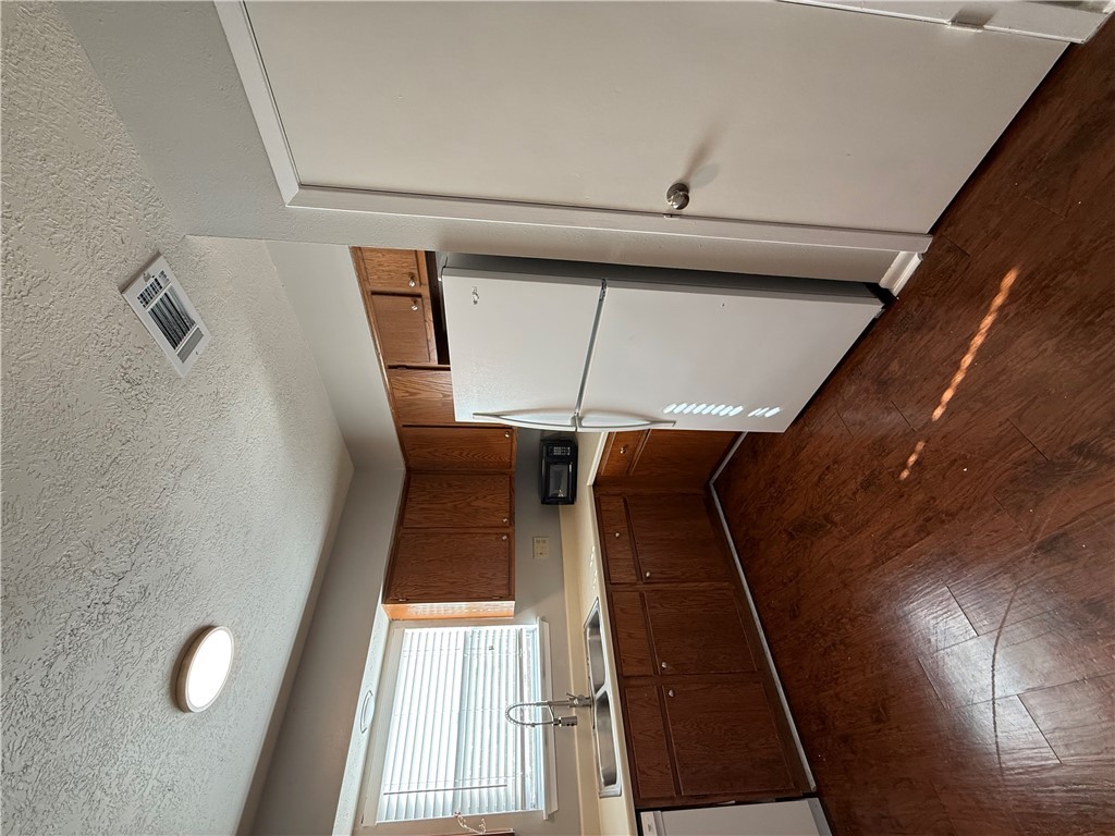 926 Spring Loop, Unit C College Station, TX 77840 - Photo 4 of 11 a kitchen with granite countertop a refrigerator a sink and a stove