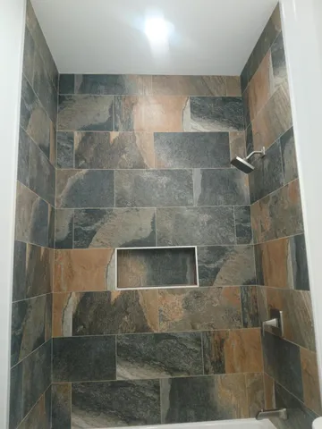 a view of kitchen with furniture and wooden floor