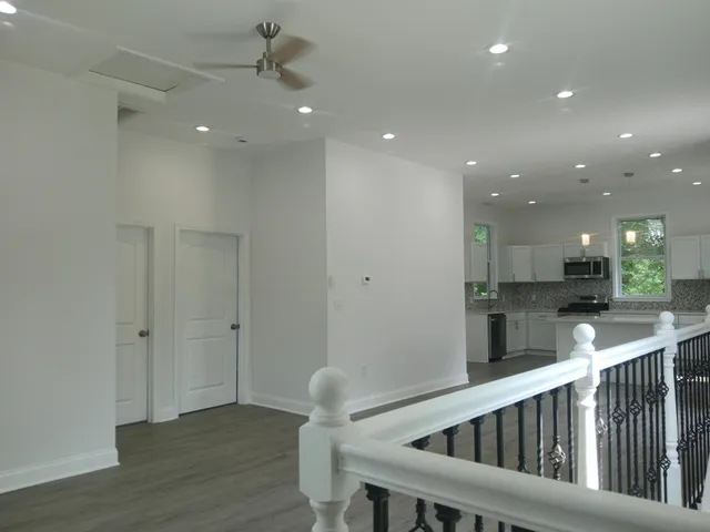 a stove top oven sitting inside of a kitchen