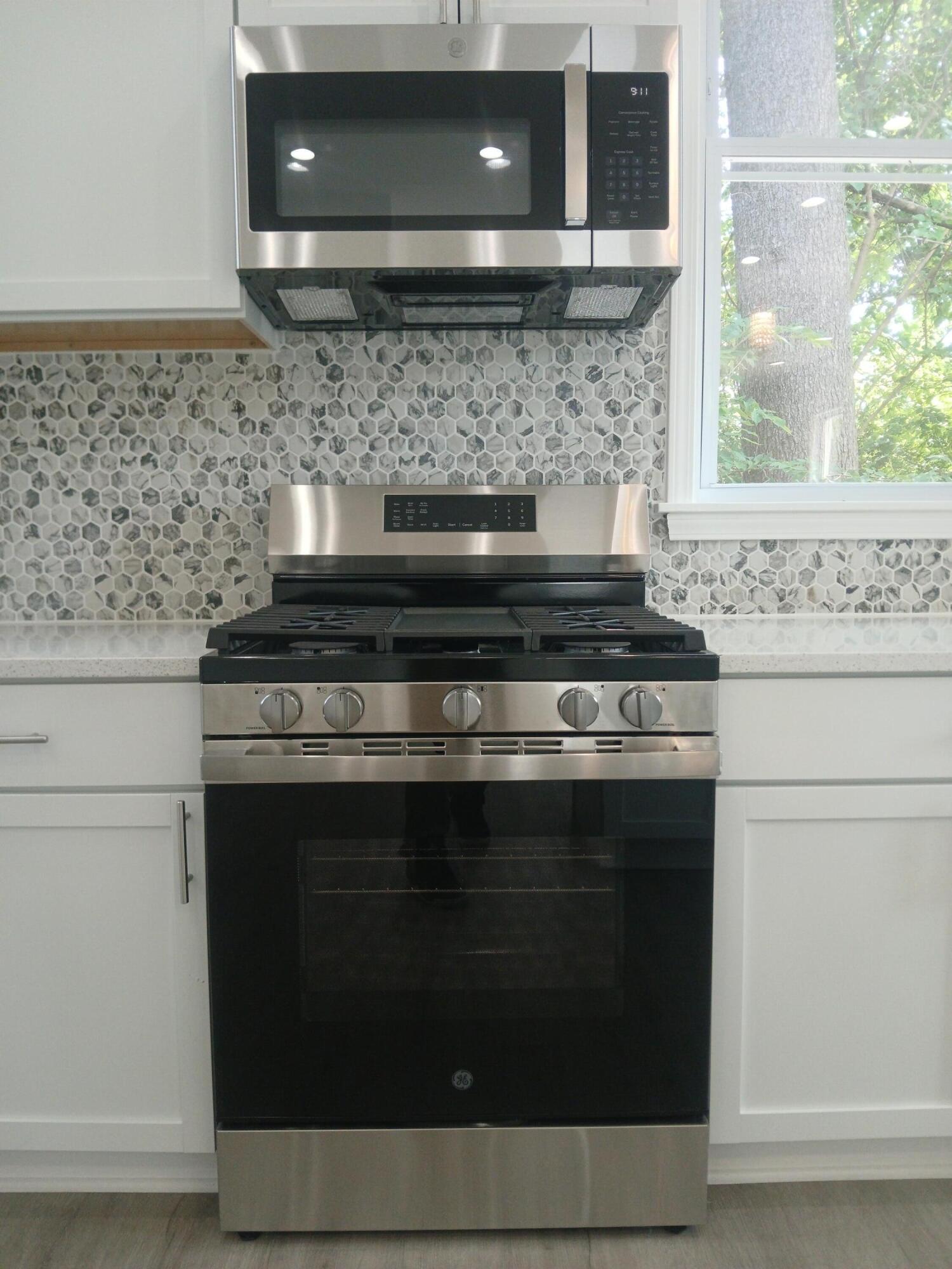 4365 Adams Street Gary, IN 46408 - Photo 22 of 68 a stove top oven sitting inside of a kitchen