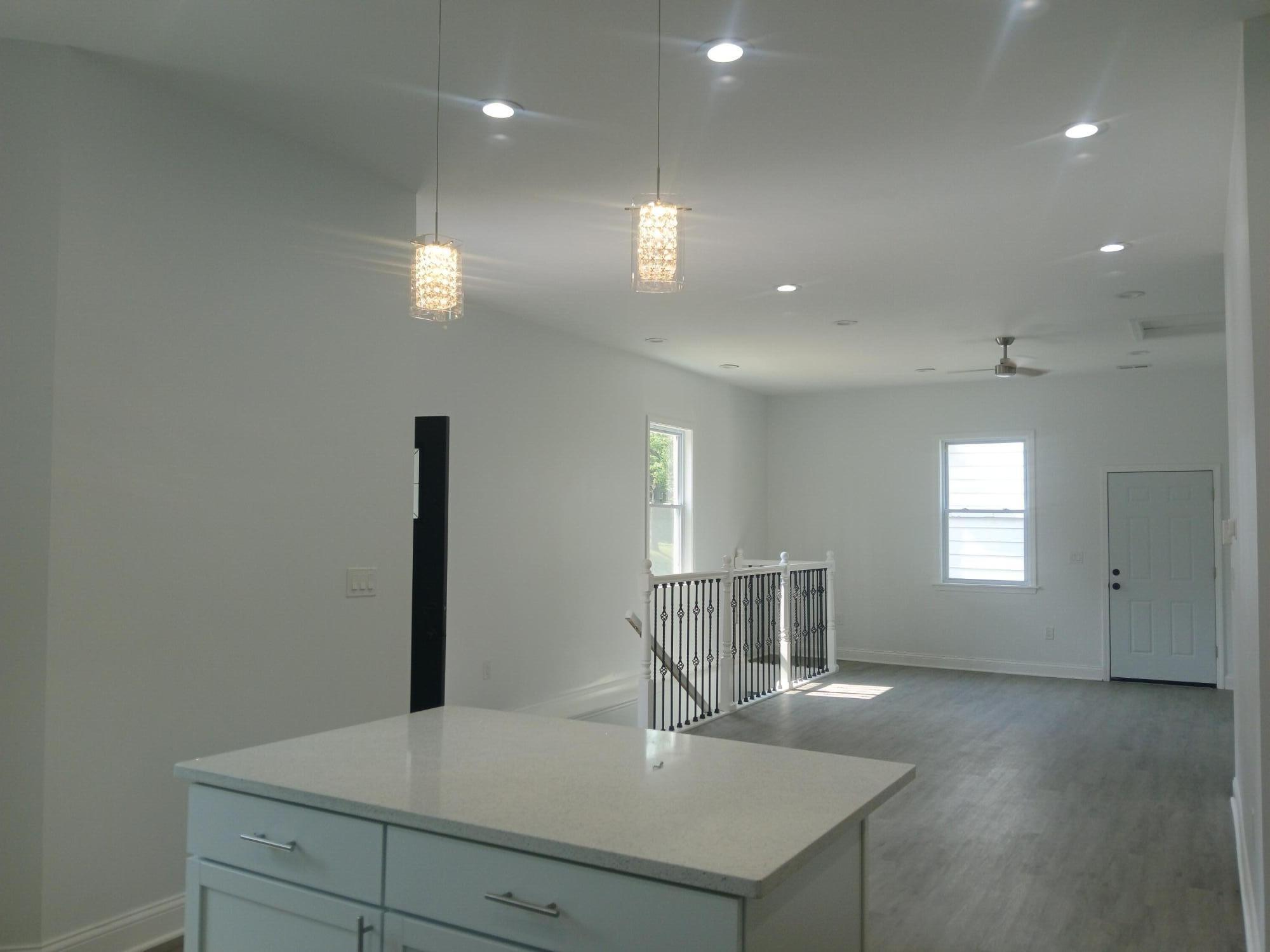 4365 Adams Street Gary, IN 46408 - Photo 25 of 68 a kitchen with kitchen island a sink stainless steel appliances and window