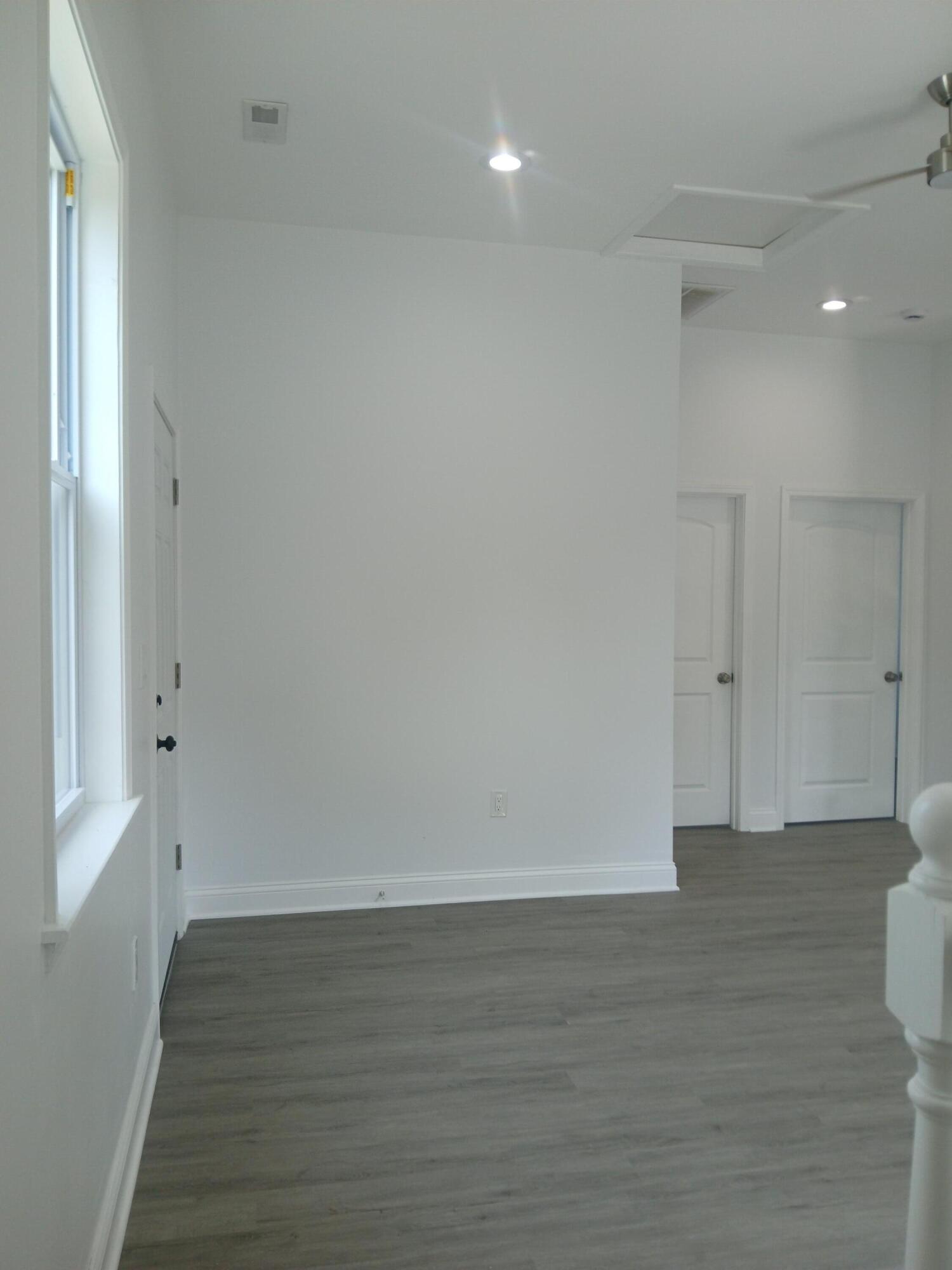 4365 Adams Street Gary, IN 46408 - Photo 31 of 68 a view of an empty room with wooden floor and a window