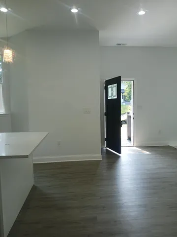 a kitchen with a table and chairs in it