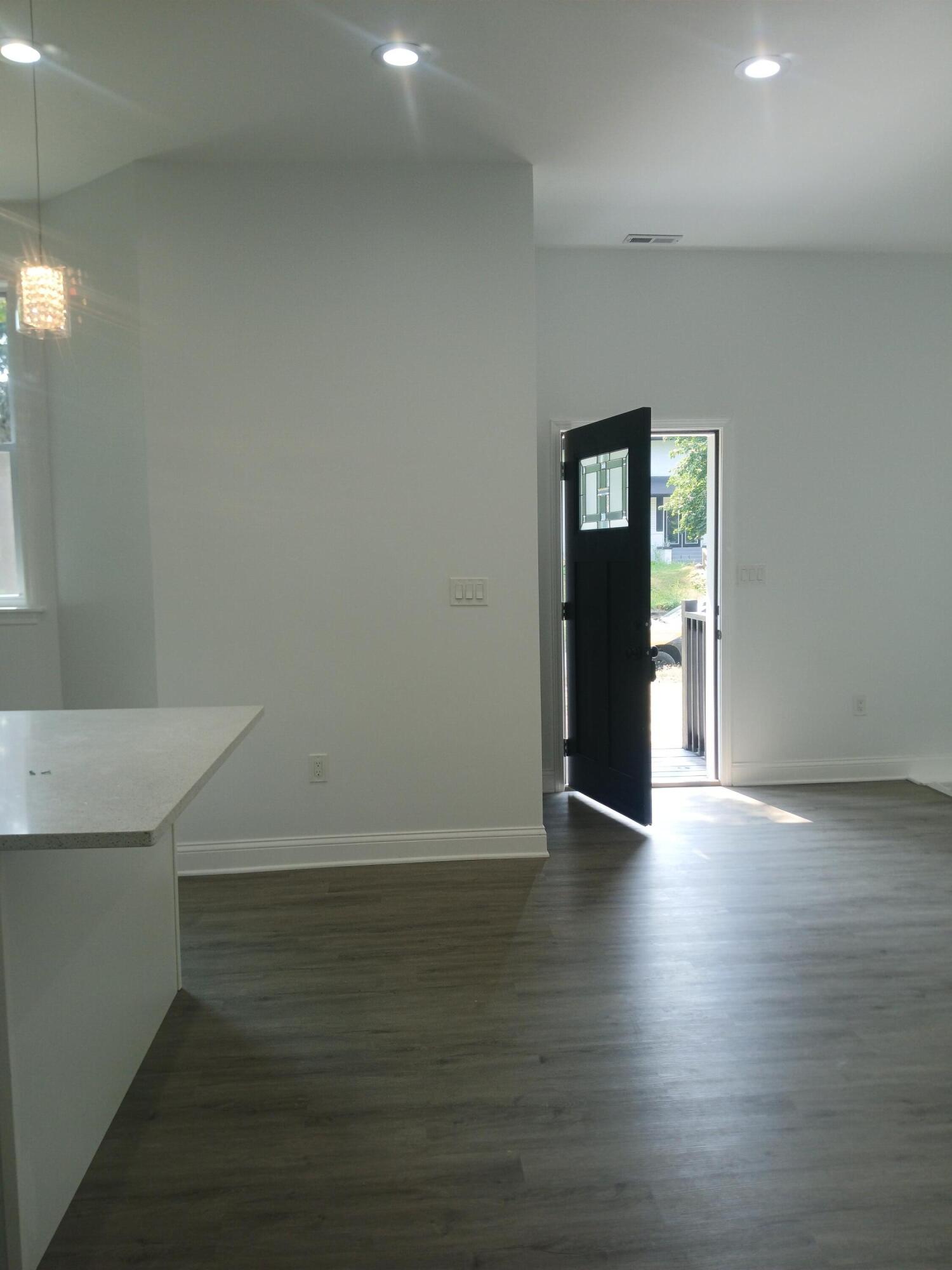 4365 Adams Street Gary, IN 46408 - Photo 4 of 68 a view of an empty room with wooden floor and stairs