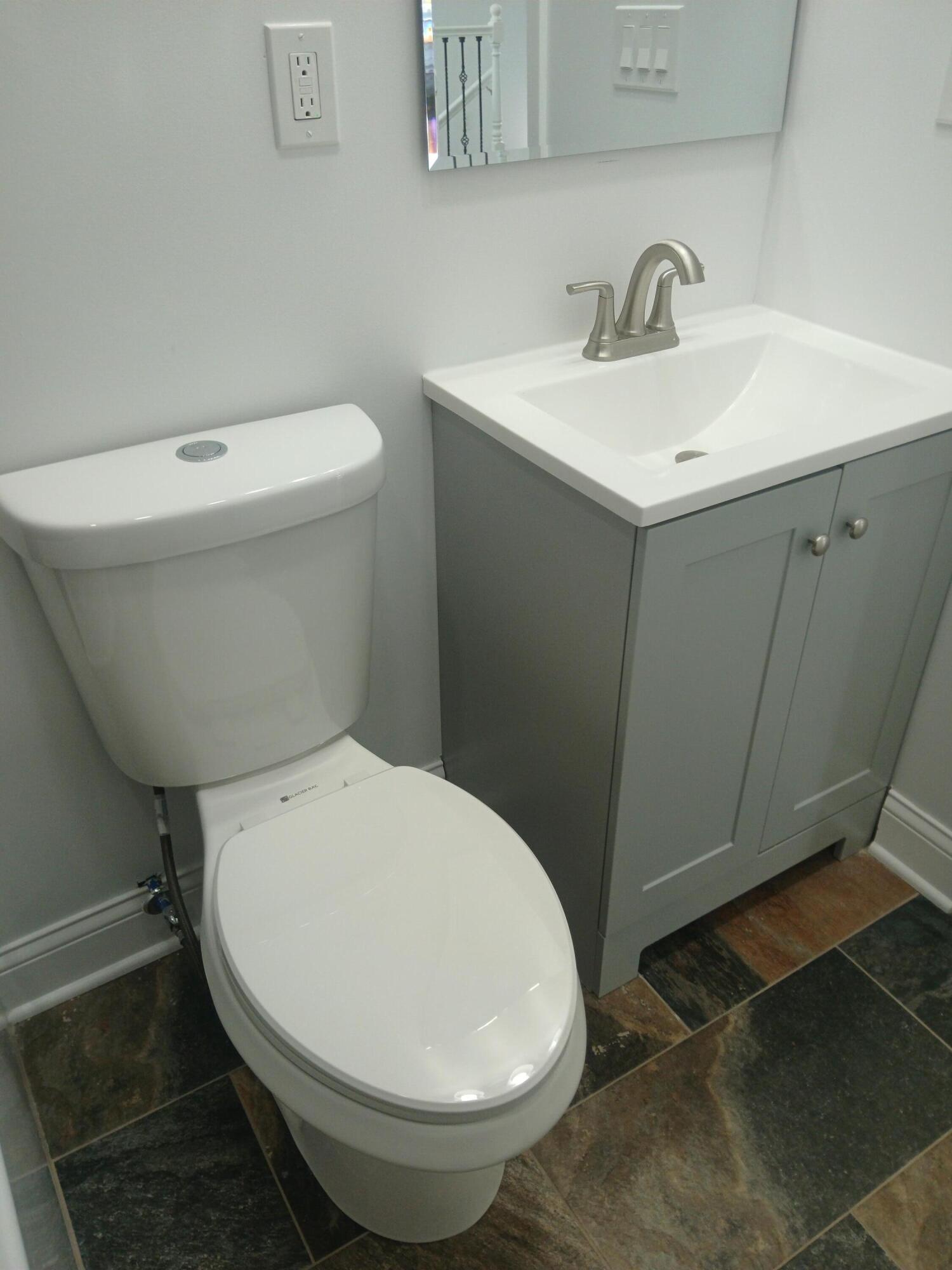 4365 Adams Street Gary, IN 46408 - Photo 45 of 68 a white toilet sitting next to a bathroom sink