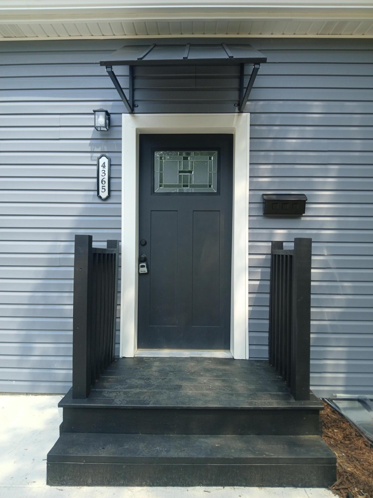 4365 Adams Street Gary, IN 46408 - Photo 67 of 68 a front view of a house with a door