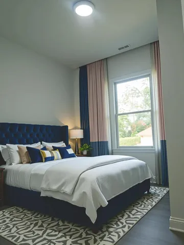 a bedroom with a bed and window