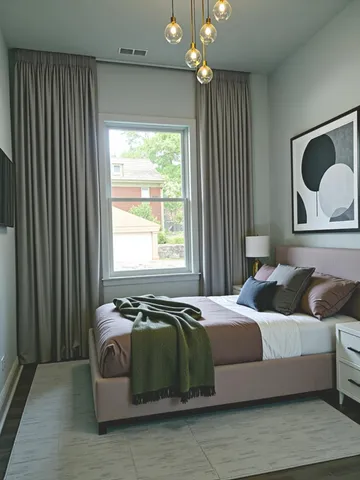 a bedroom with bed and window