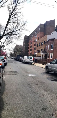a view of street with parked cars