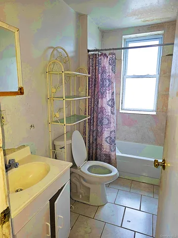 a bathroom with a sink a toilet and a bathtub